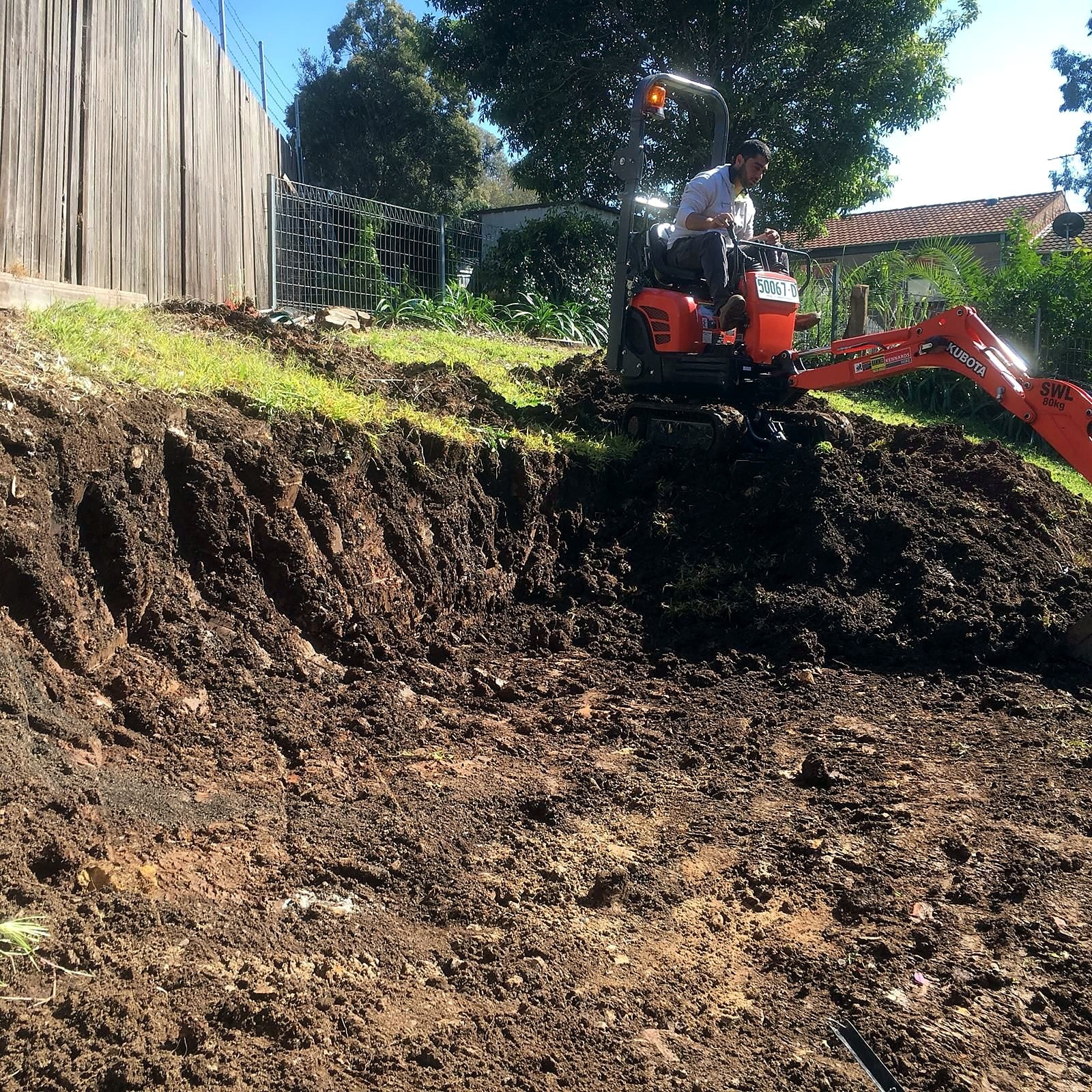Excavation underway in the sloped Ermington lawn area