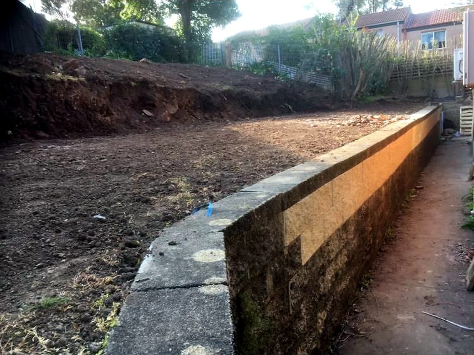 Cleared Ermington lawn platform beside the lower pathway