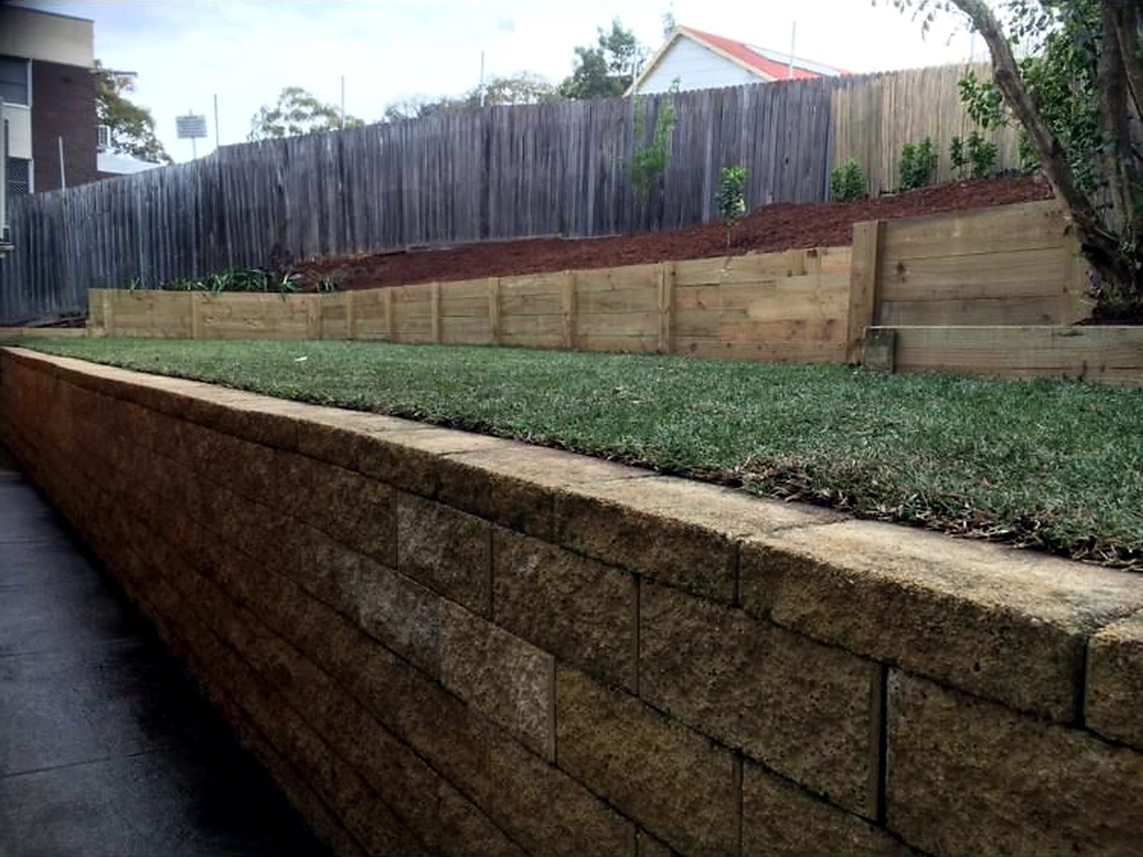 Completed natural turf above a timber sleeper edge in Ermington