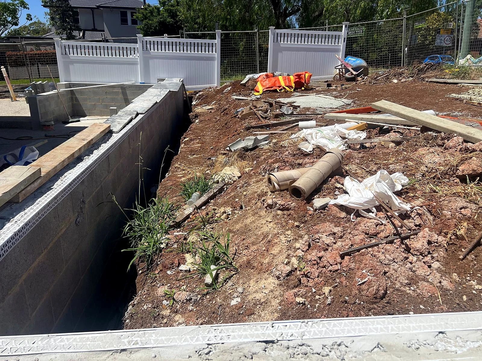 Front lawn preparation beside the boundary fence in Turramurra
