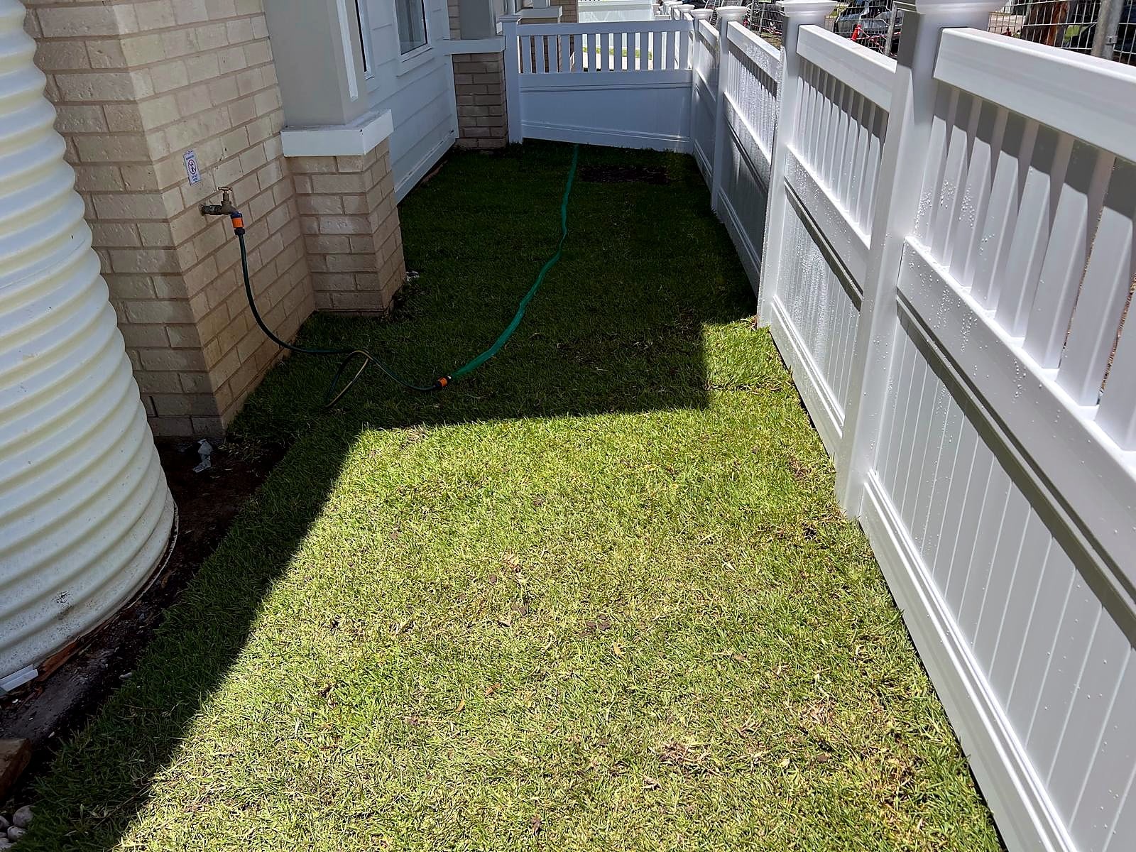 Finished turf along the white boundary fence in Turramurra