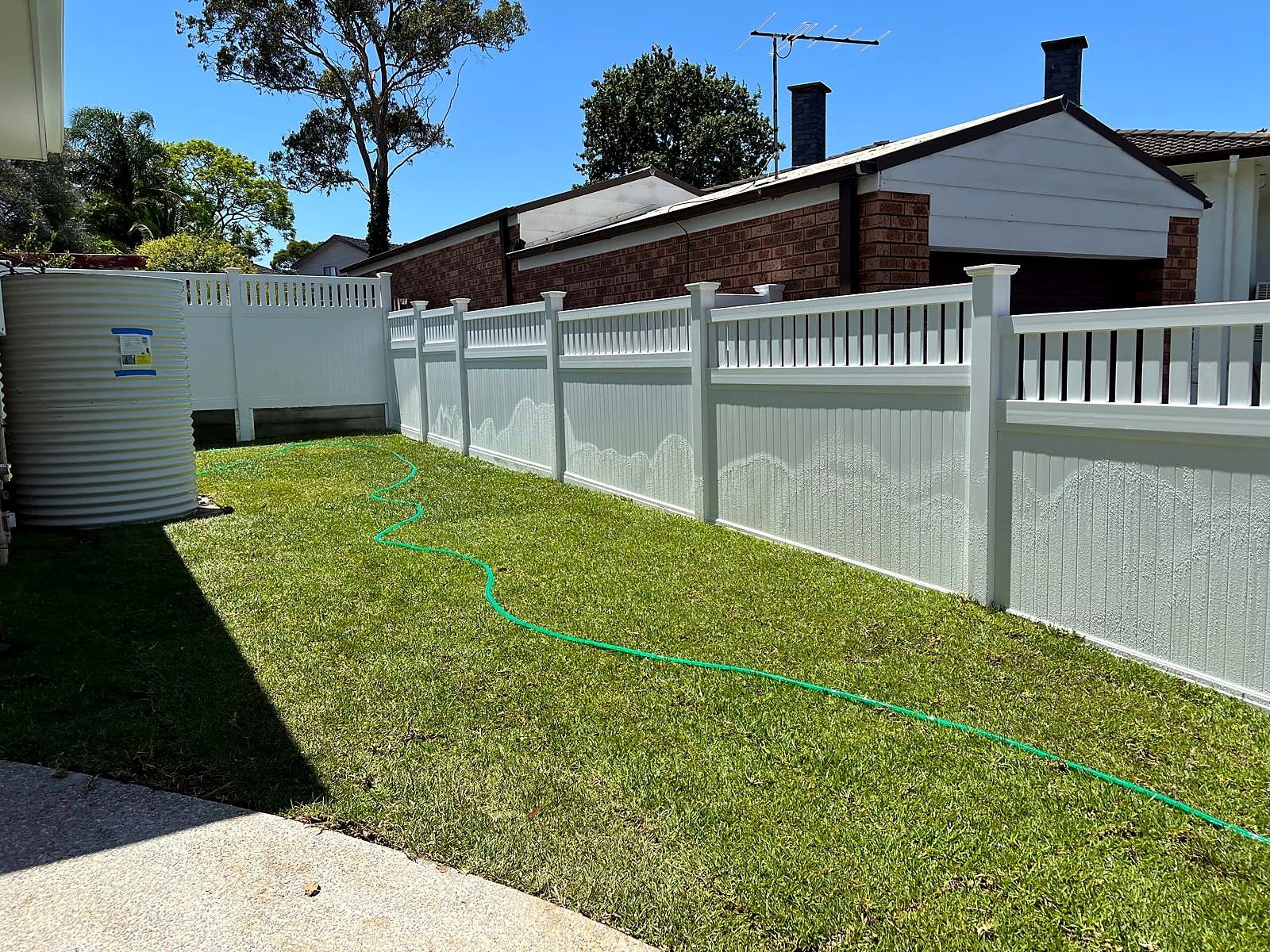 Completed side lawn with natural turf and adjoining concrete path in Turramurra